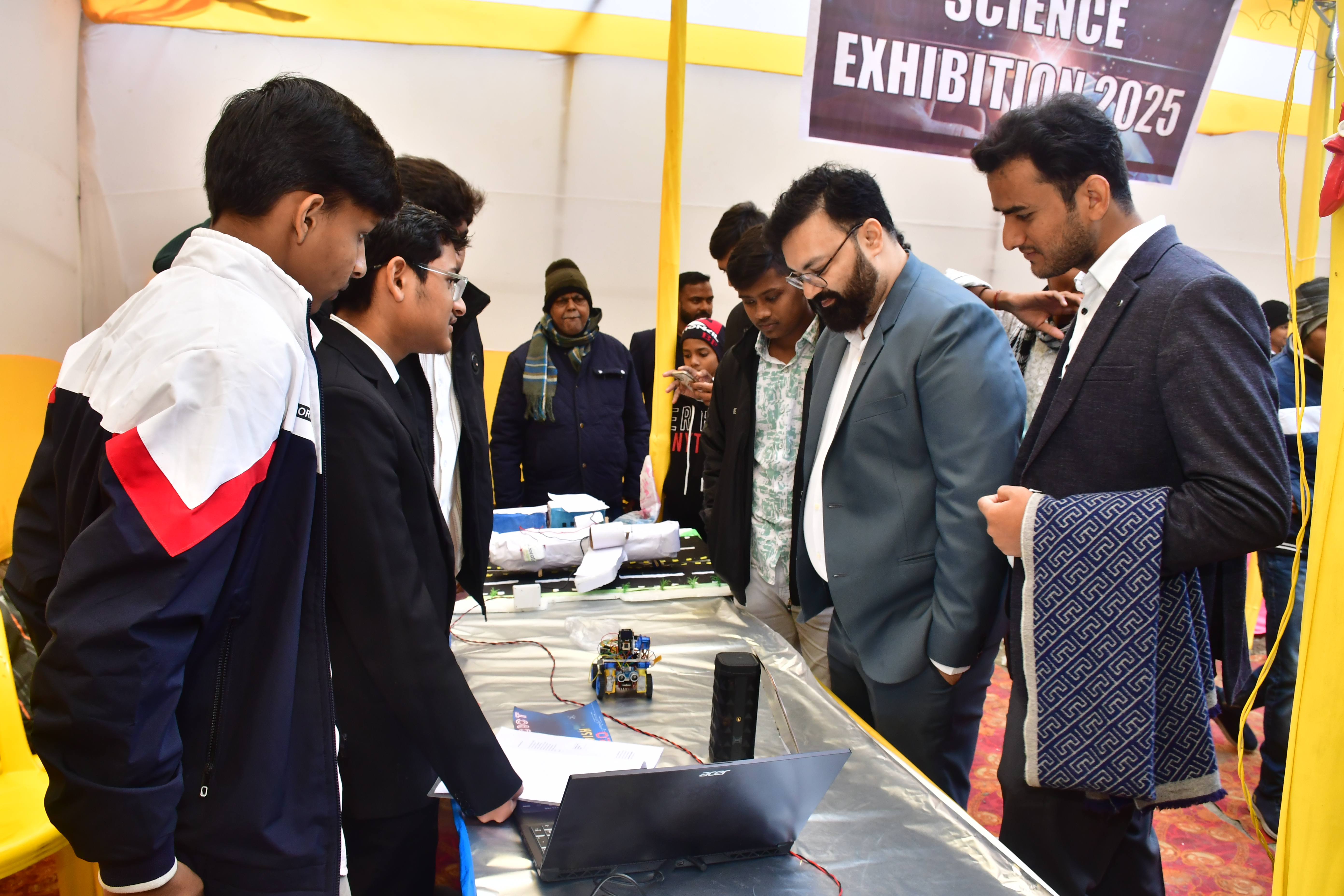 Aman Vishwas presenting a robotics project at a science exhibition in India